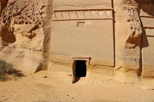 Beautiful daytime view of Al Hegra, Madain Saleh archaeological site in Al Ula, Saudi Arabia. photo