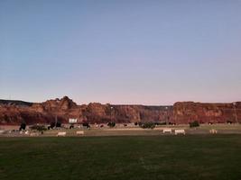 A beautiful daytime view of a winter park in Al Ula, Saudi Arabia. The park is surrounded by ancient hills. photo