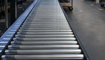 Conveyor belt inside a manufacturing site or distribution warehouse photo