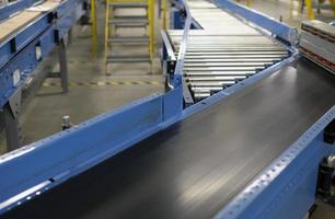 Conveyor belt inside a manufacturing site or distribution warehouse photo