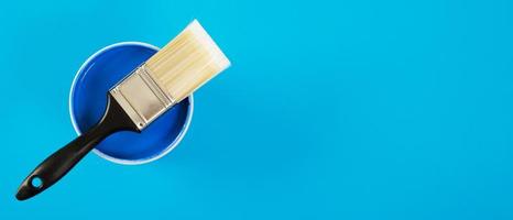 Paint cans and paint brushes and how to choose the perfect interior paint color and good for health photo