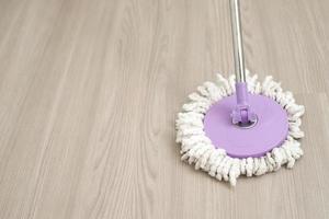 Employees use mop cloths to clean the floor inside the house. photo