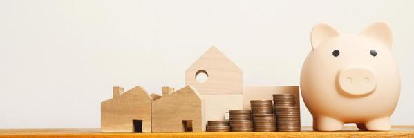 White piggy bank for saving money, buying a house photo