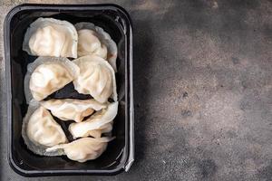 dumplings dim sum rice flour dough Chinese food meal snack on the table copy space food background rustic top view photo
