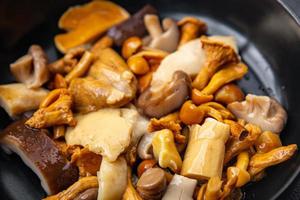 mushroom salad mix appetizer white mushroom, boletus mushroom, chanterelle mushroom, ready to eat healthy meal food snack on the table copy space food background rustic top view photo