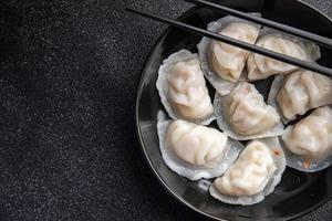 dumplings dim sum rice flour dough Chinese food meal snack on the table copy space food background rustic top view photo