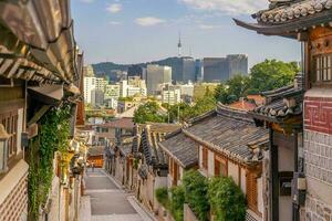 Bukchon Hanok Village with Seoul city skyline, cityscape South Korea photo