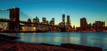 Manhattan city skyline cityscape of New York with Brooklyn Bridge photo