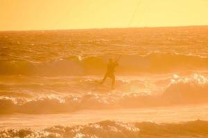 Kitesurfer at sunset photo