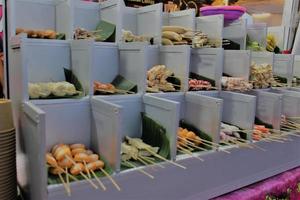 various kinds of satay in the night market photo