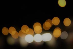 Blur background of sparkling lights with dark background photo