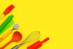culinary background, culinary accessories on yellow background with copy space photo