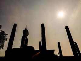 Buddhist sculptures at a temple in Bangkok, Thailand photo