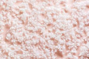 Texture background soft synthetic fluff on a pink background photo