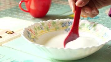 Slow motion of pick fresh yogurt with a spoon video