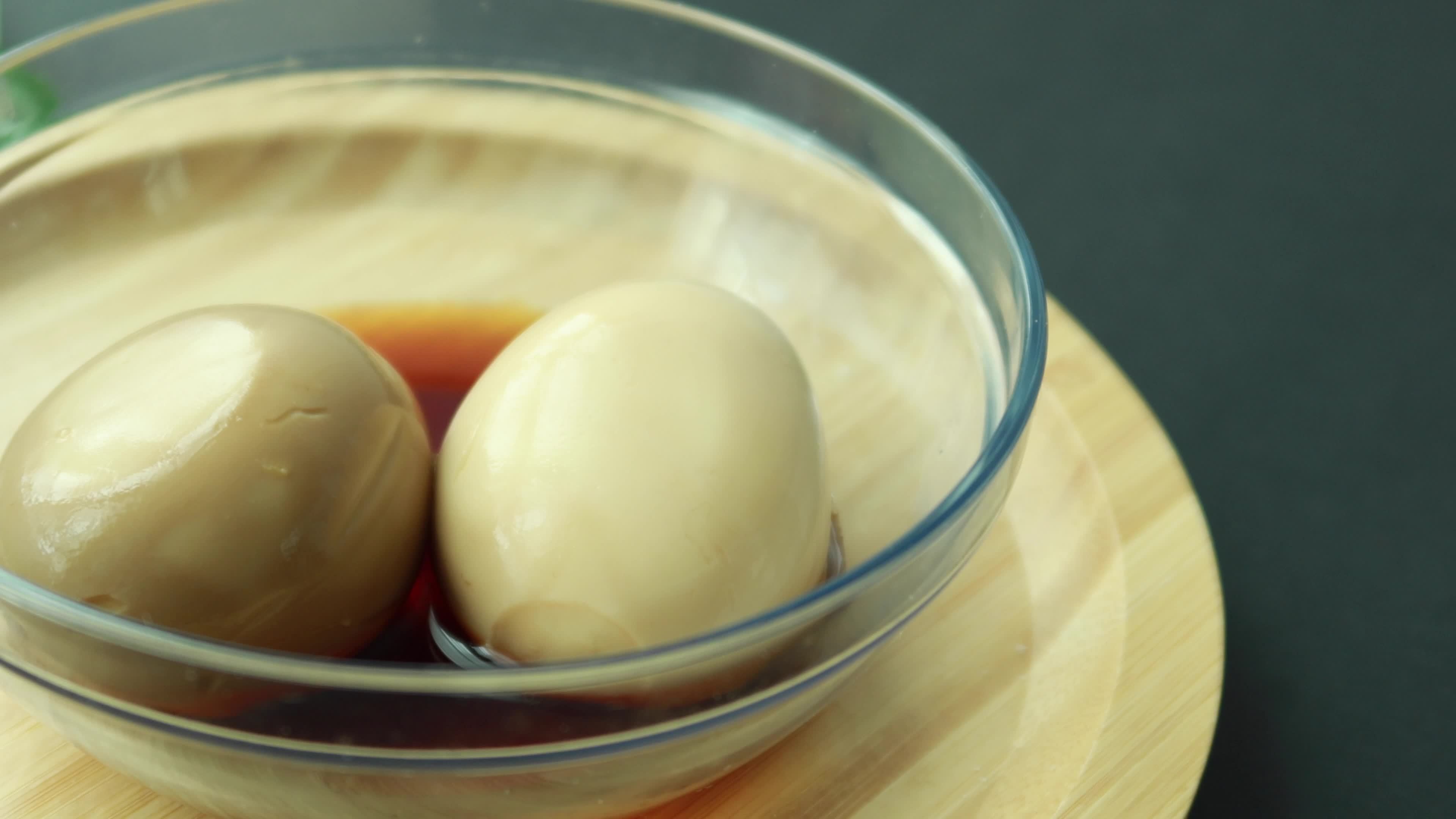 soy sauce marinated egg in a bowl . 21858816 Stock Video at Vecteezy