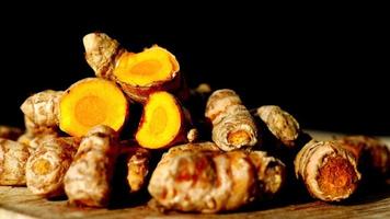 detail shot of turmeric root in bowl on table , video