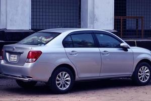 Bangladesh, February 17, 2020. Car Back side view. Luxury Cars Parking on Road beside Building. Automobile in natural Background. photo