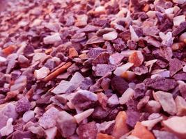 Stack of broken stones.Big pile of broken Rocks and Boulders.Pile stack of huge natural granite stone.Stack of Crushed Stones in quarry. Colorful pebble. photo