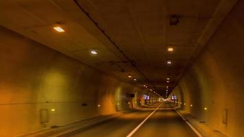 timelpase of driving through a tunnel  in barcelona with lights. video