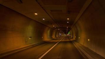 timelpase of driving through a tunnel  in barcelona with lights. video