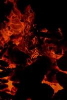 Fire flames on black background, Blaze fire flame texture background, Beautifully, the fire is burning, Fire flames with wood and cow dung bonfire photo