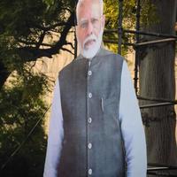 New Delhi, India - January 16 2023 - Prime Minister Narendra Modi cut out during BJP road show, the statue of PM Modi while attending a big election rally in the capital photo