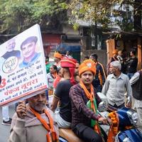 Delhi, India, December 02 2022 -Bharatiya Janata Party - BJP supporter during mega road show in support of BJP candidate Pankaj Luthara to file nomination papers ahead of MCD local body Elections 2022 photo