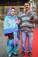 New Delhi, India - December 04 2022 - Unidentified people showing their ink-marked fingers after casting votes in front of polling booth of east Delhi area for MCD local body Elections 2022 photo