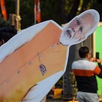New Delhi, India - January 16 2023 - Prime Minister Narendra Modi cut out during BJP road show, the statue of PM Modi while attending a big election rally in the capital photo