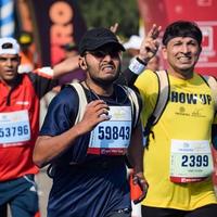 New Delhi, India - October 16 2022 - Vedanta Delhi Half Marathon race after covid in which marathon participants about to cross the finish line, Delhi Half Marathon 2022 photo