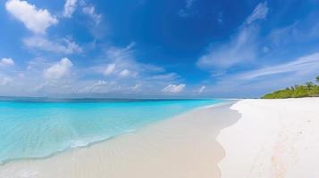 Beautiful sandy beach with white sand and rolling calm wave of turquoise ocean on Sunny day on background white clouds in blue sky. colorful perfect panoramic natural landscape. photo