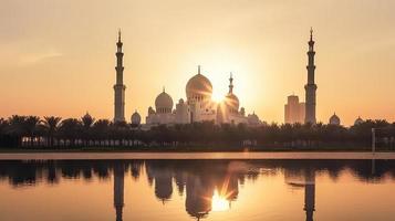 abu dhabi, eau, jeque zayed grandioso mezquita en el abu dhabi, unido árabe emiratos en un puesta de sol ver antecedentes. foto