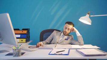 The bored businessman does not want to work and is overwhelmed. Bored businessman does not want to work and is distracted. video