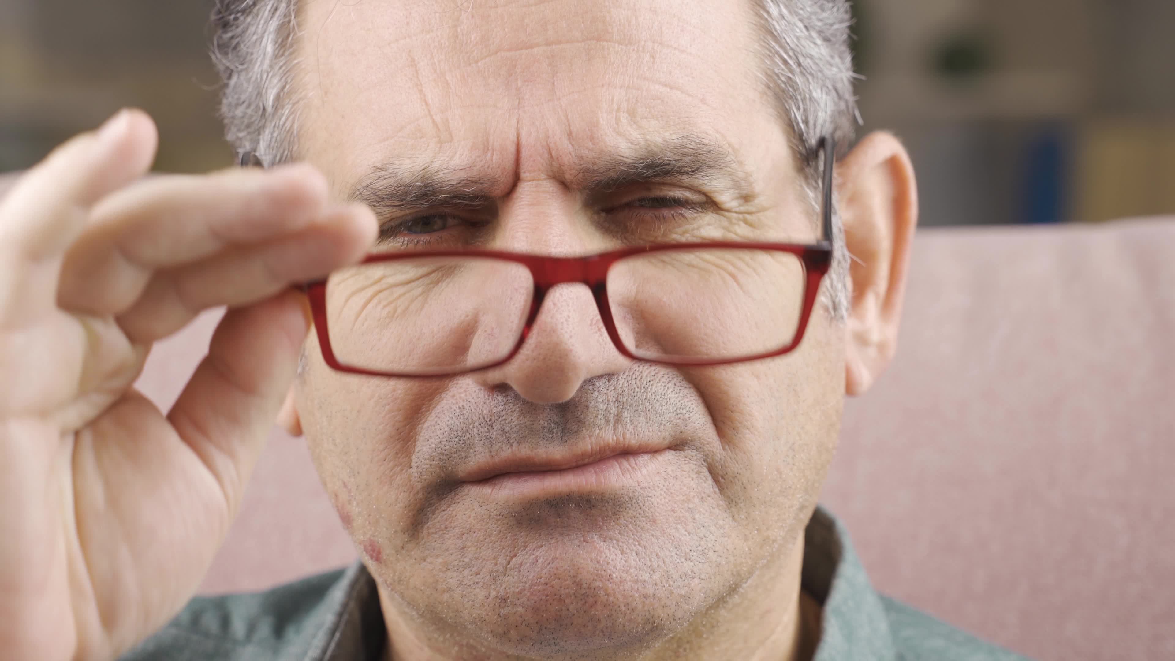 Closeup of man with sore eyes. Tired eyes. The man, whose eyes hurt