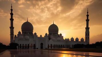 abu dhabi, eau, jeque zayed grandioso mezquita en el abu dhabi, unido árabe emiratos en un puesta de sol ver antecedentes. foto