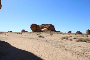 Beautiful daytime view of Al Hegra, Madain Saleh archaeological site in Al Ula, Saudi Arabia. photo