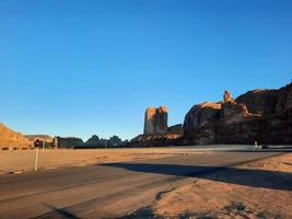 A beautiful daytime view of a winter park in Al Ula, Saudi Arabia. The park is surrounded by ancient hills. photo