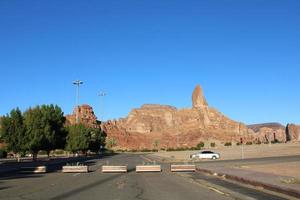 A beautiful daytime view of a winter park in Al Ula, Saudi Arabia. The park is surrounded by ancient hills. photo