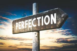 Perfection - Wooden Signpost with one Arrow, Sunset Sky in Background photo