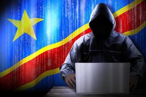 Anonymous Hooded Hacker and Flag Of Democratic Republic of Congo, Binary Code - Cyber Attack Concept photo