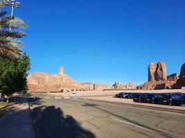 A beautiful daytime view of a winter park in Al Ula, Saudi Arabia. The park is surrounded by ancient hills. photo