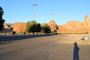 A beautiful daytime view of a winter park in Al Ula, Saudi Arabia. The park is surrounded by ancient hills. photo