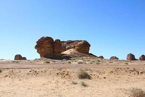 Beautiful daytime view of Al Hegra, Madain Saleh archaeological site in Al Ula, Saudi Arabia. photo