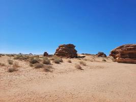 Beautiful daytime view of Al Hegra, Madain Saleh archaeological site in Al Ula, Saudi Arabia. photo