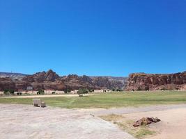 A beautiful daytime view of a winter park in Al Ula, Saudi Arabia. The park is surrounded by ancient hills. photo