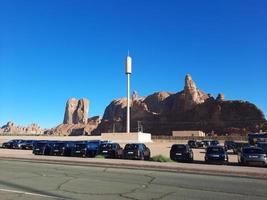 Al Ula, Saudi Arabia, March 2023 - Jeeps are parked at different places in the desert to take tourists to different places during the day in Al Ula, Saudi Arabia. photo