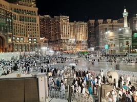 Mecca, Saudi Arabia, March 2023 - A large number of Umrah pilgrims in front of the Clock Tower in Masjid Al Haram. photo