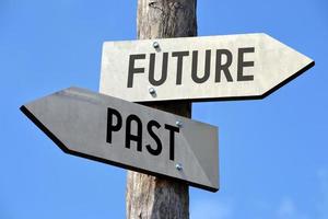 Future and Past - Wooden Signpost with Two Arrows photo