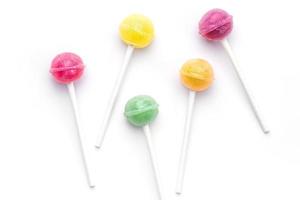 Sweet lollipops on white background